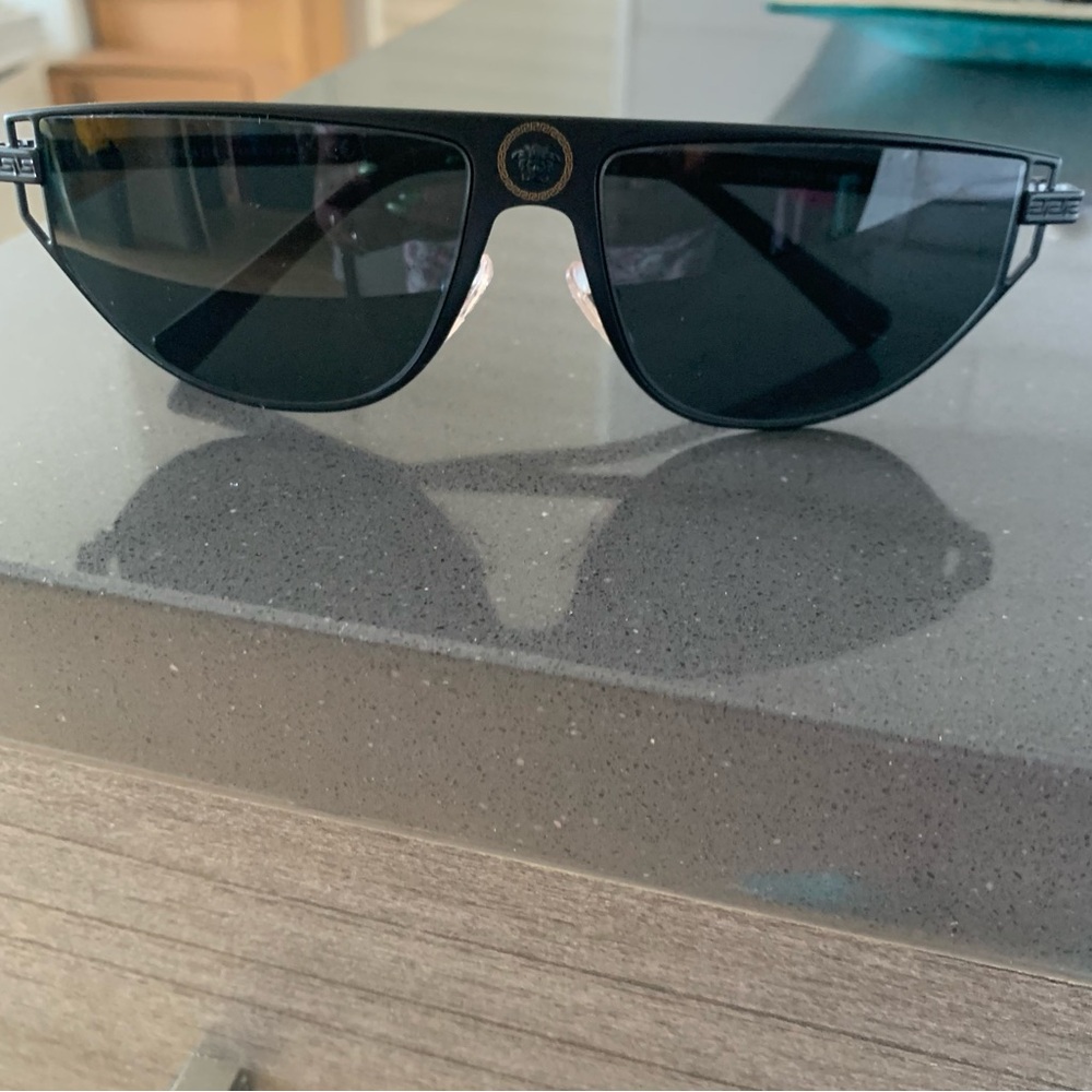 Prada Chic Black Sunglasses with Gold Detail!

You will stand out in these!
